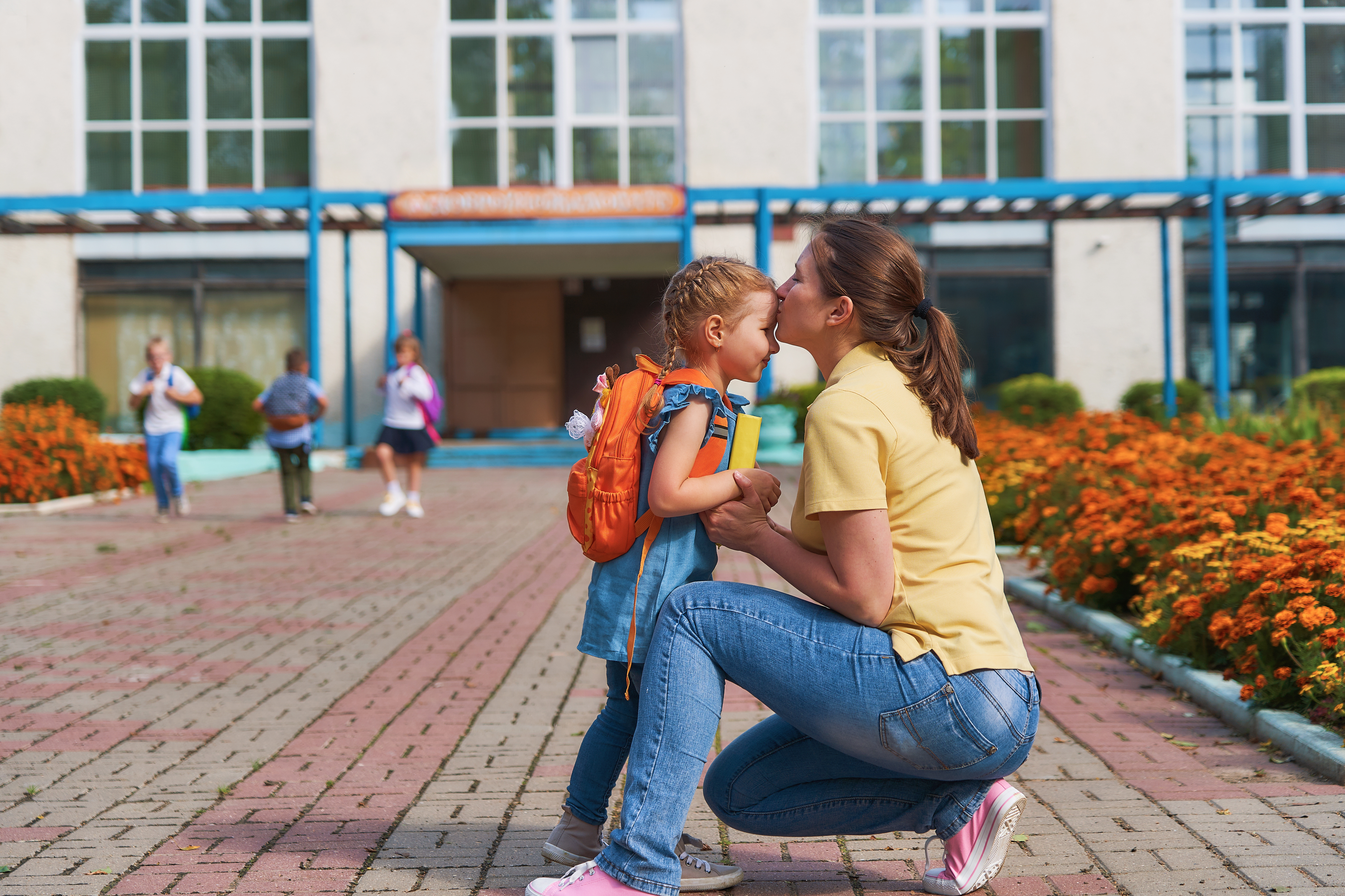 Parent dropping child off at school